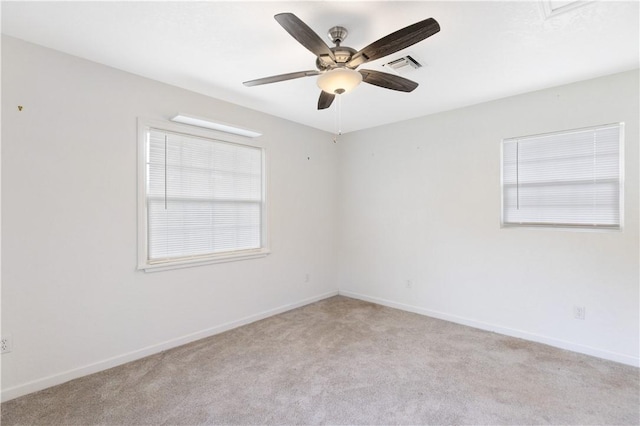 carpeted empty room with ceiling fan