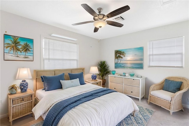 bedroom featuring ceiling fan and light carpet