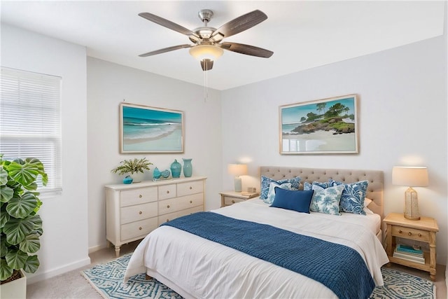 bedroom featuring ceiling fan and light colored carpet