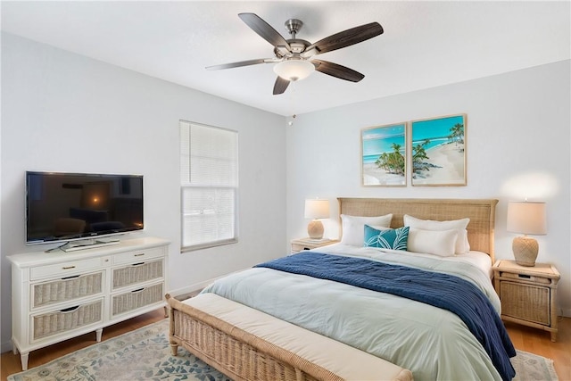 bedroom with ceiling fan and light wood-type flooring