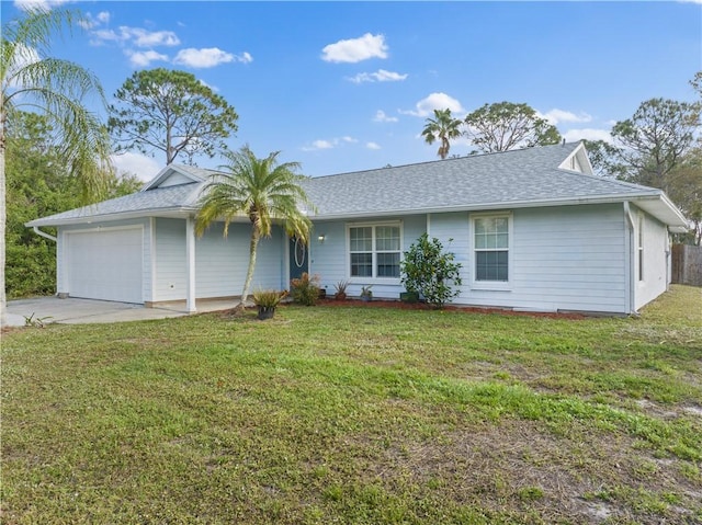 ranch-style home with a garage and a front lawn