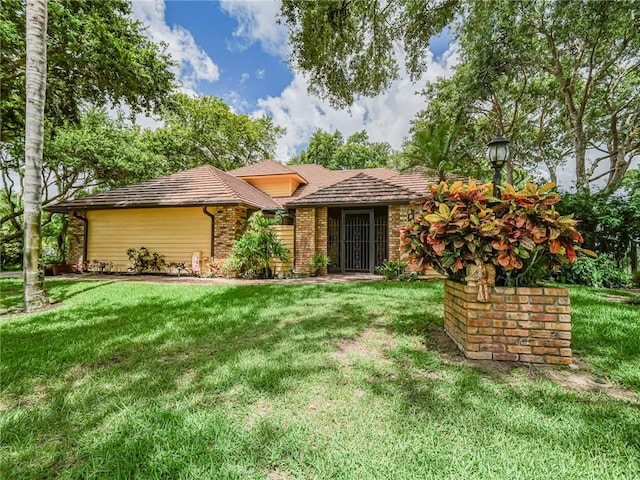 505 Cross Creek Cir, Sebastian, FL 32958 - view of front of property with a front lawn and brick siding
