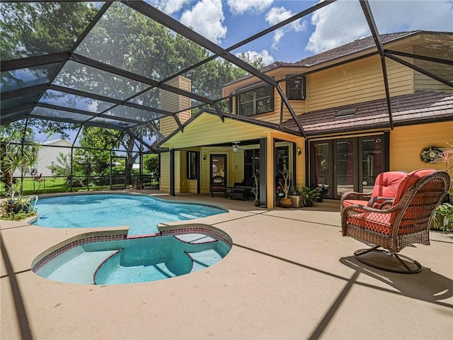505 Cross Creek Cir, Sebastian, FL 32958 - view of swimming pool featuring french doors, a patio area, a pool with connected hot tub, and a lanai