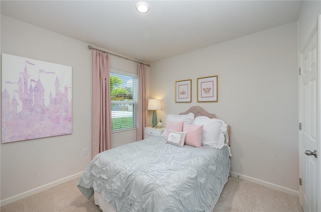 carpeted bedroom with baseboards