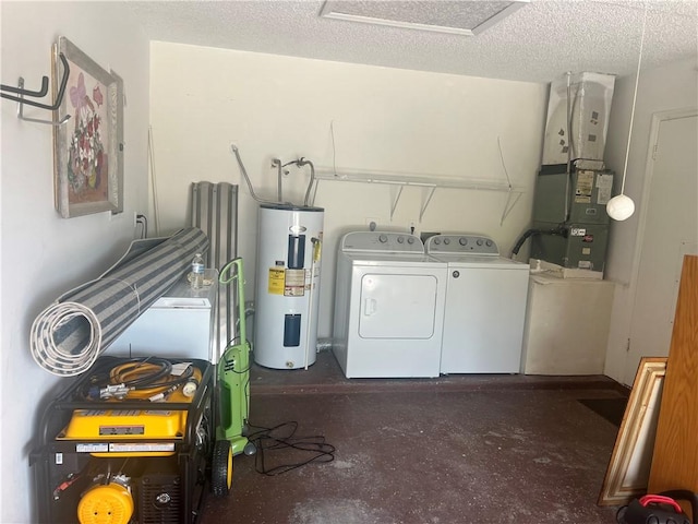 laundry area with a textured ceiling, electric water heater, heating unit, and independent washer and dryer