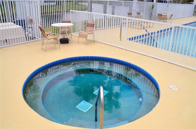 1910 Westminster Cir Unit 14-1, Vero Beach, FL 32966 - view of pool featuring a pool, a hot tub, and a patio