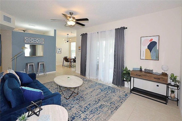 1910 Westminster Cir Unit 14-1, Vero Beach, FL 32966 - tiled living area with ceiling fan and baseboards