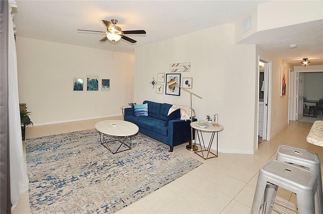 1910 Westminster Cir Unit 14-1, Vero Beach, FL 32966 - tiled living room with ceiling fan and baseboards