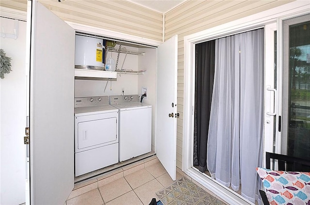 1910 Westminster Cir Unit 14-1, Vero Beach, FL 32966 - laundry area with washing machine and dryer and light tile patterned floors