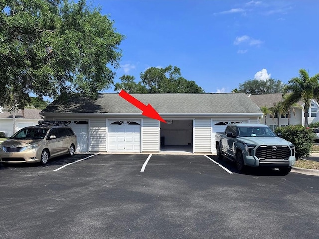 1910 Westminster Cir Unit 14-1, Vero Beach, FL 32966 - view of front facade featuring roof with shingles