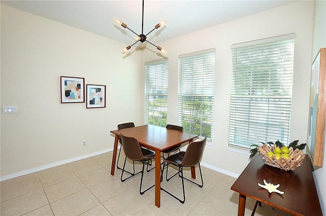 1910 Westminster Cir Unit 14-1, Vero Beach, FL 32966 - dining room with baseboards, light tile patterned floors, and a chandelier