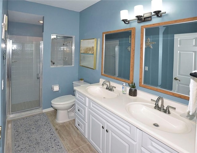 1910 Westminster Cir Unit 14-1, Vero Beach, FL 32966 - full bathroom featuring a shower stall, double vanity, toilet, and baseboards