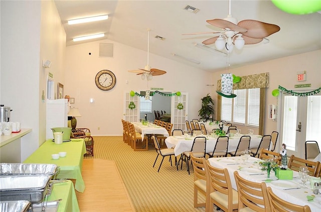1910 Westminster Cir Unit 14-1, Vero Beach, FL 32966 - carpeted dining room featuring a ceiling fan and high vaulted ceiling