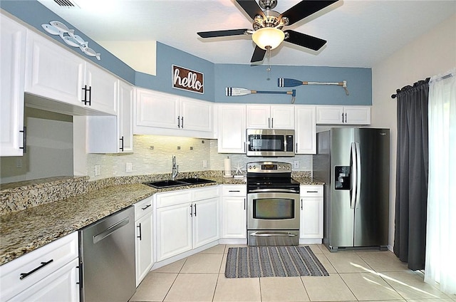 1910 Westminster Cir Unit 14-1, Vero Beach, FL 32966 - kitchen featuring appliances with stainless steel finishes, a sink, white cabinetry, and a ceiling fan