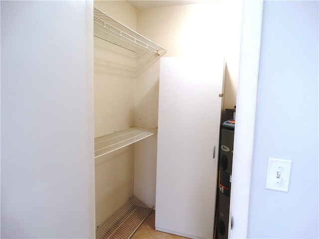walk in closet with light tile patterned flooring