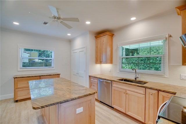 kitchen featuring light brown cabinets, sink, stainless steel appliances, and tasteful backsplash