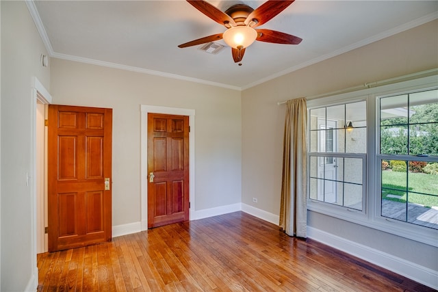 unfurnished room featuring ceiling fan, light hardwood / wood-style flooring, and crown molding