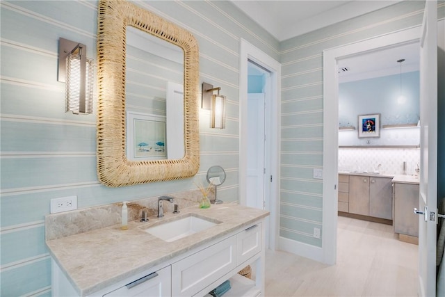 110 Mariner Beach Ln, Vero Beach, FL 32963 - bathroom with vanity, wood finished floors, and wallpapered walls
