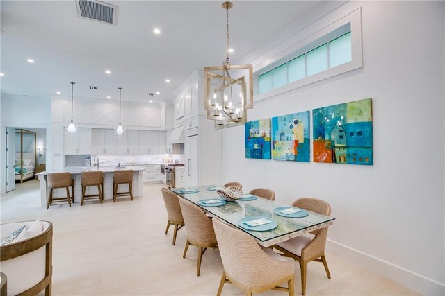 110 Mariner Beach Ln, Vero Beach, FL 32963 - dining room featuring a chandelier and recessed lighting