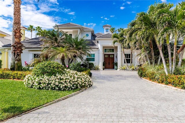 110 Mariner Beach Ln, Vero Beach, FL 32963 - view of front of property with stucco siding, decorative driveway, and a tile roof