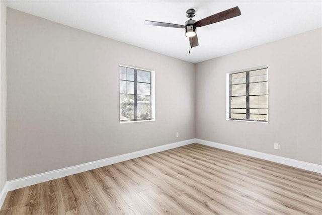 spare room with light hardwood / wood-style floors and ceiling fan