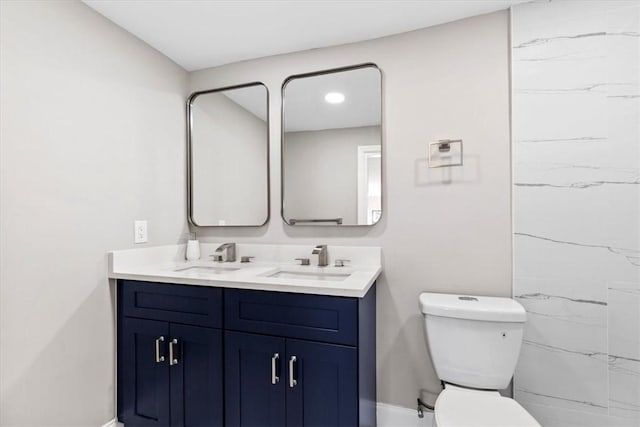 bathroom featuring vanity, a shower, and toilet