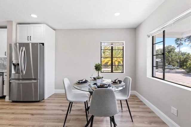 dining space featuring light hardwood / wood-style floors