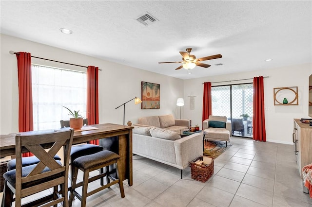 426 12th St SW, Vero Beach, FL 32962 - living area with ceiling fan, light tile patterned flooring, recessed lighting, a textured ceiling, and baseboards