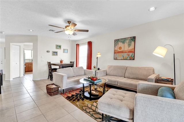 426 12th St SW, Vero Beach, FL 32962 - living room with light tile patterned flooring, a ceiling fan, recessed lighting, and baseboards
