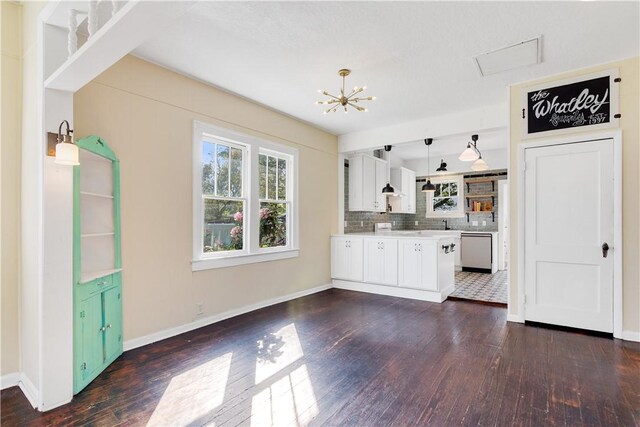 interior space featuring dark hardwood / wood-style flooring and a chandelier