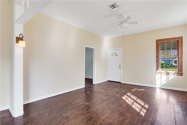 unfurnished room with dark wood-type flooring and ceiling fan