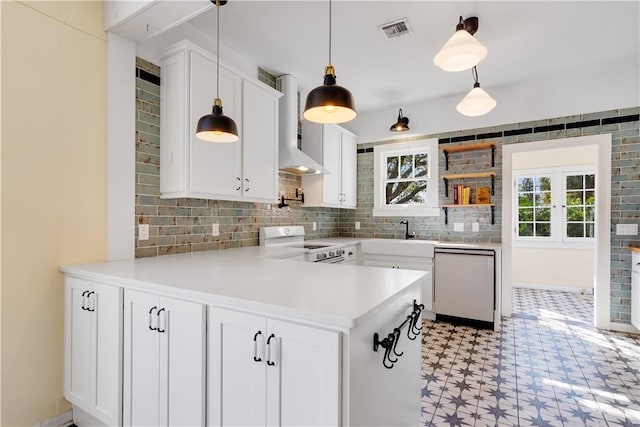 kitchen with decorative light fixtures, white cabinetry, dishwasher, kitchen peninsula, and electric stove