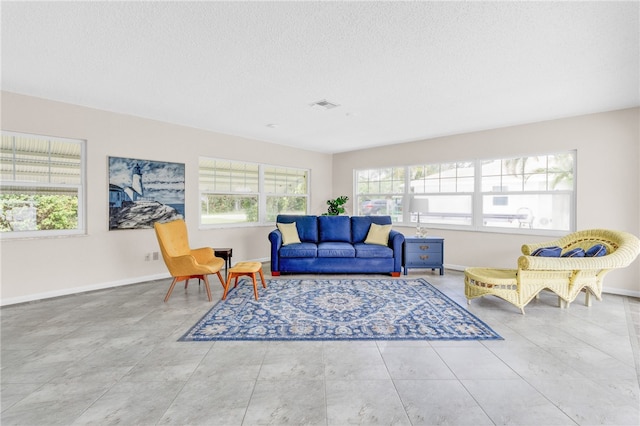 living room with a textured ceiling