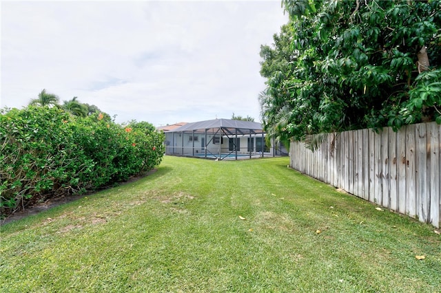 view of yard featuring a lanai