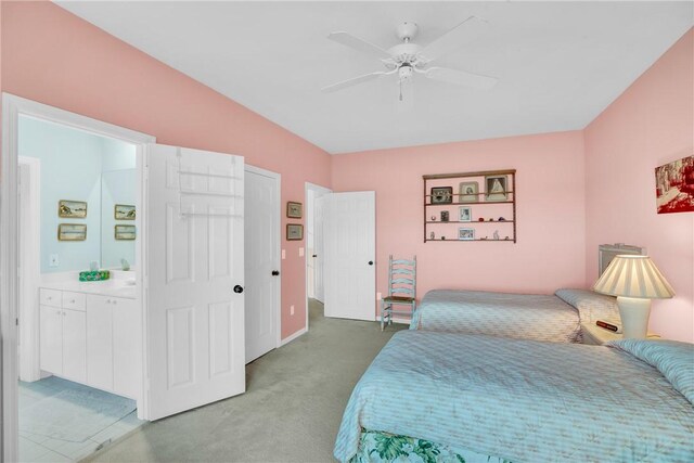 1725 Victoria Cir, Vero Beach, FL 32967 - bedroom featuring ceiling fan, light carpet, and ensuite bath