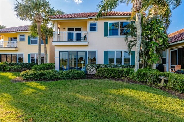 1725 Victoria Cir, Vero Beach, FL 32967 - back of property featuring stucco siding, a lawn, and a tiled roof