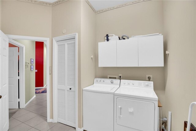 1725 Victoria Cir, Vero Beach, FL 32967 - clothes washing area featuring light tile patterned floors, baseboards, cabinet space, and washing machine and dryer