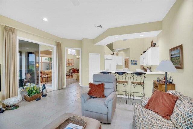 1725 Victoria Cir, Vero Beach, FL 32967 - living room with light tile patterned floors, visible vents, and recessed lighting