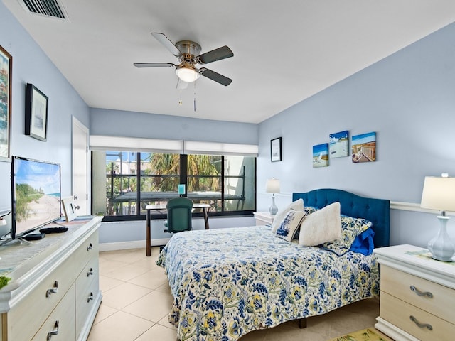 bedroom with ceiling fan and light tile patterned flooring