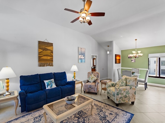 tiled living room with ceiling fan with notable chandelier and vaulted ceiling