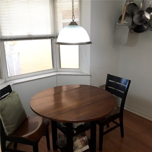 dining area featuring wood-type flooring