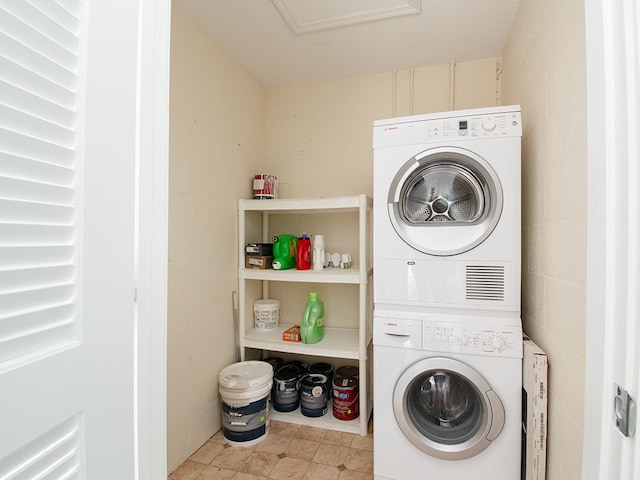 laundry area with stacked washing maching and dryer and laundry area