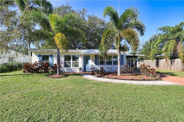 ranch-style home featuring a front yard