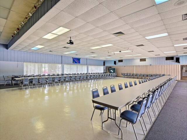 dining area featuring a drop ceiling