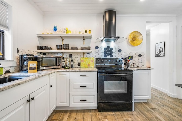 kitchen with white cabinetry, light hardwood / wood-style flooring, exhaust hood, and black / electric stove