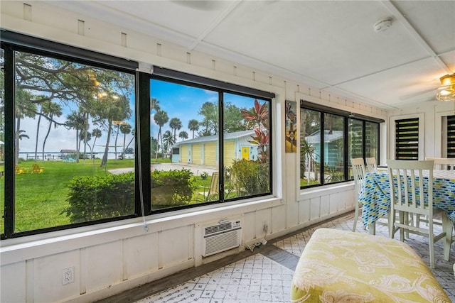 sunroom / solarium with a wall unit AC