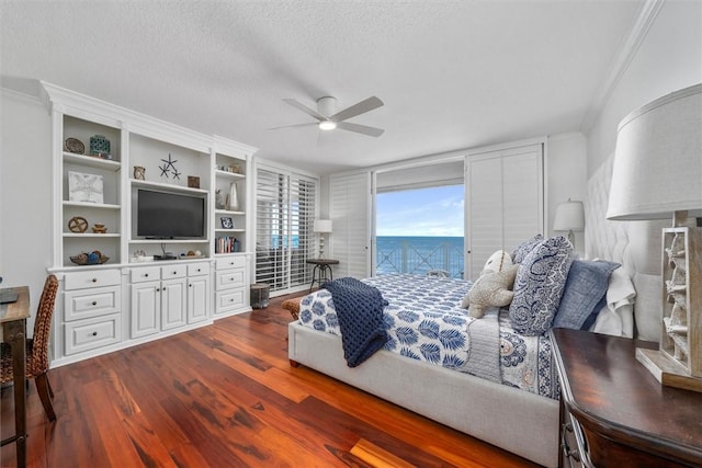 bedroom featuring access to outside, crown molding, ceiling fan, a textured ceiling, and wood-type flooring