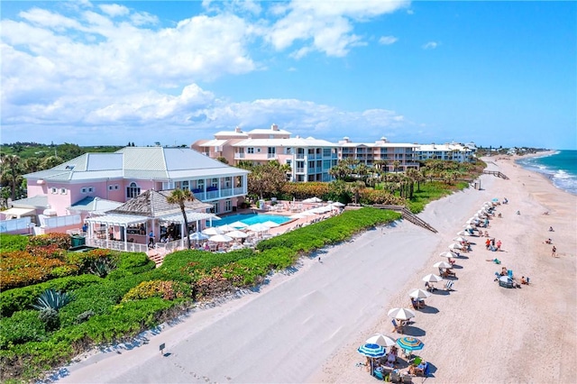 drone / aerial view with a water view and a view of the beach