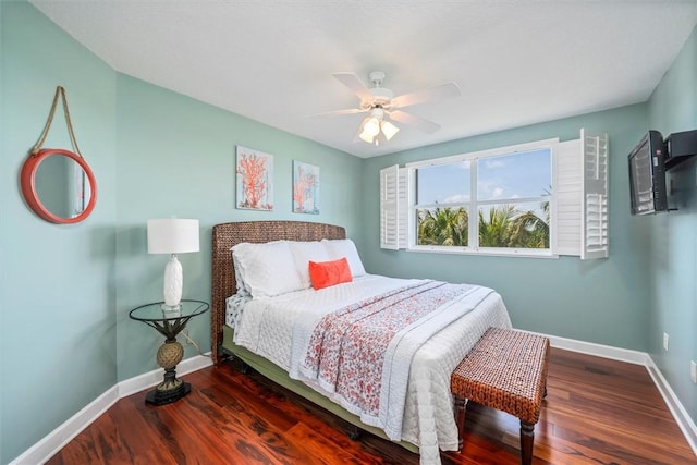 bedroom with ceiling fan and dark wood-type flooring