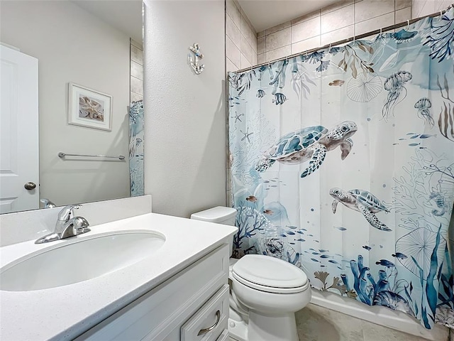 bathroom with vanity, toilet, and a shower with curtain